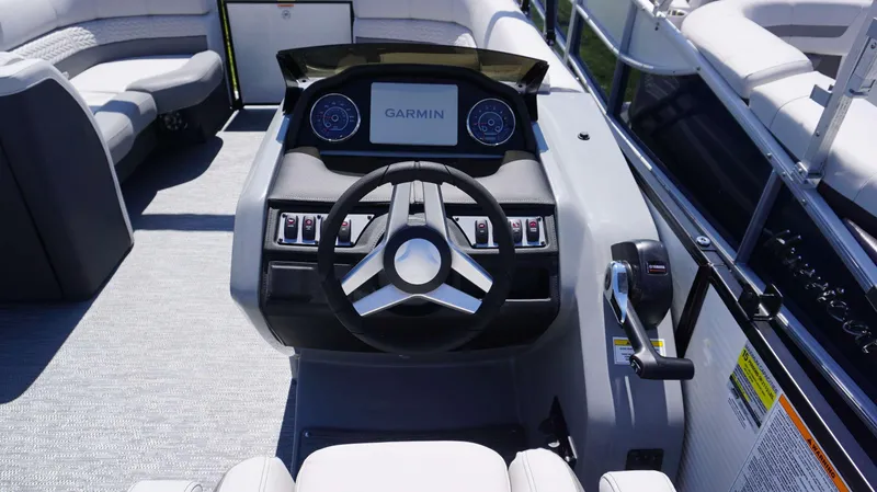 Slide: The Image of 2024 MONACO 235 DFL boat dashboard with Garmin display and Yamaha throttle. - 6