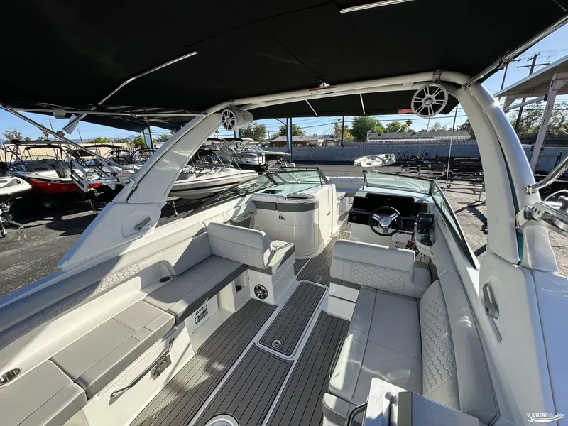 Slide: The Image of 2024 Sea Ray SDX 290 OB boat interior with luxurious seating and modern dashboard. - 4