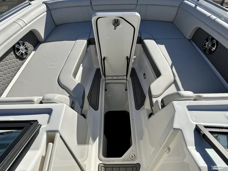 Slide: The Image of 2024 Sea Ray SDX 290 OB boat interior with open storage compartment. - 8