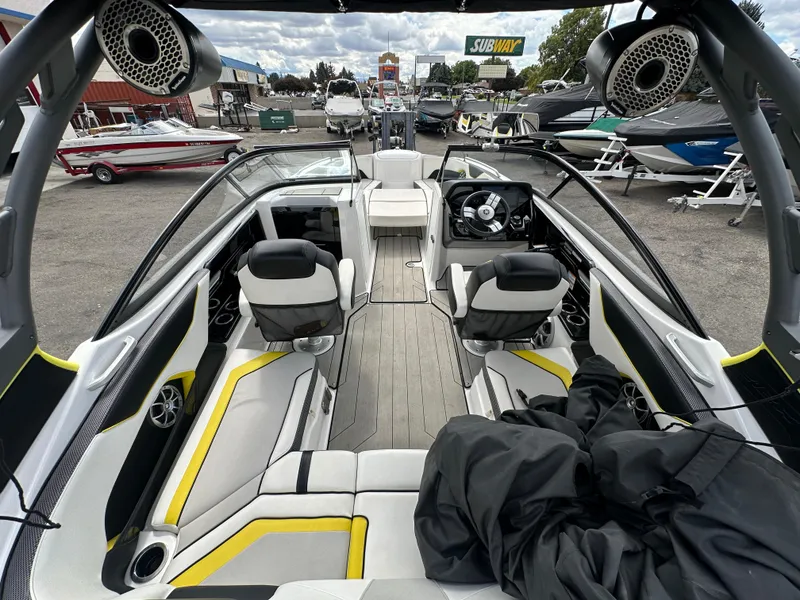Slide: The Image of 2020 Yamaha 212X jet boat interior with modern seating and sleek design. - 12