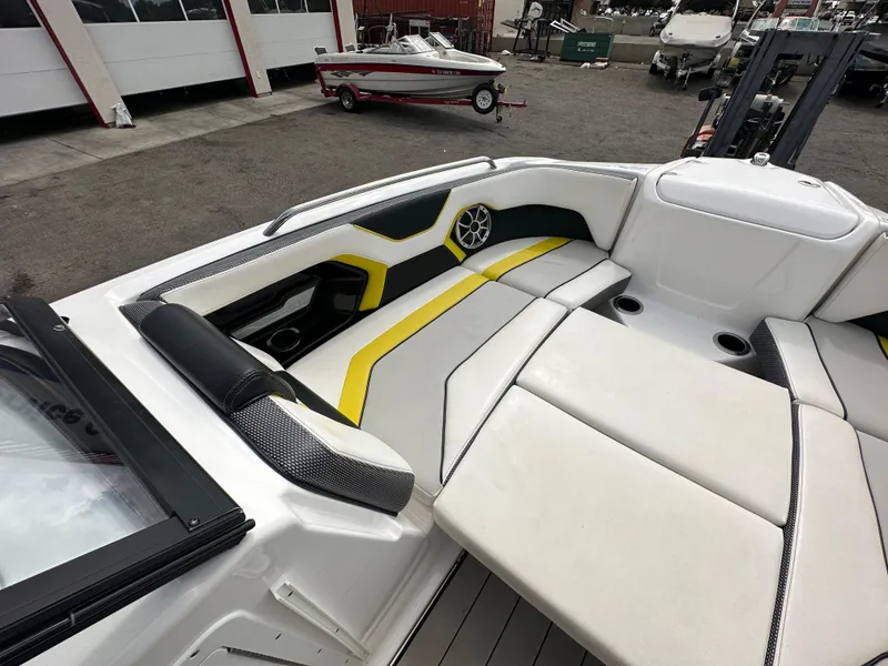 Slide: The Image of 2020 Yamaha 212X jet boat interior with stylish seating and speaker system. - 13