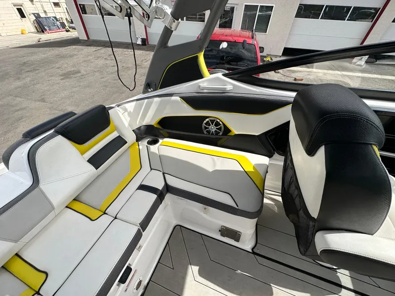 Slide: The Image of 2020 Yamaha 212X jet boat interior with stylish seating and speaker system. - 20