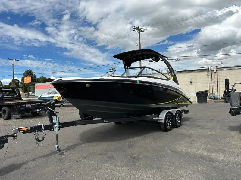 Slide: The Image of 2020 Yamaha 212X jet boat on trailer under cloudy sky. - 4