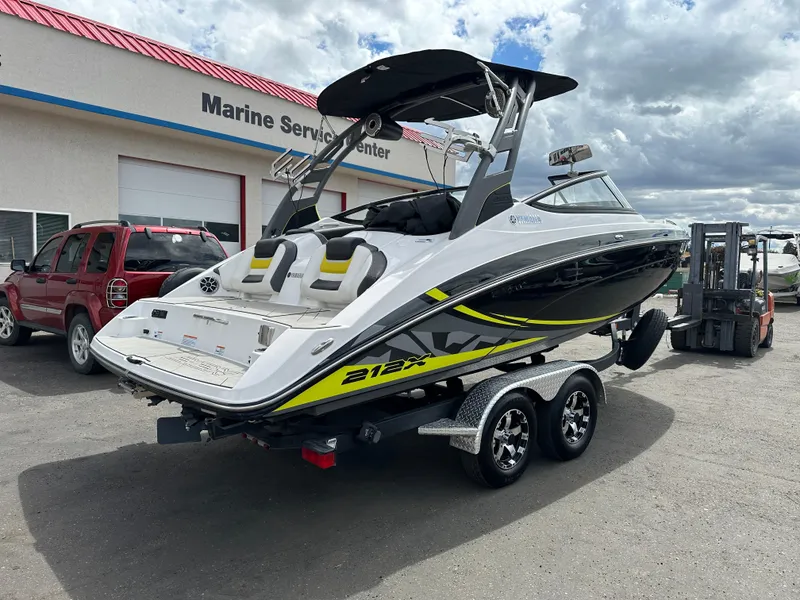 Slide: The Image of 2020 Yamaha 212X jet boat on trailer at marine service center. - 8