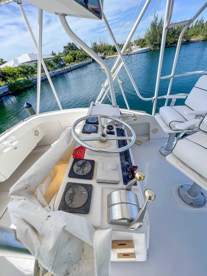 Slide: The Image of Helm of 2000 Luhrs 400 Convertible yacht with steering wheel and navigation instruments. - 10