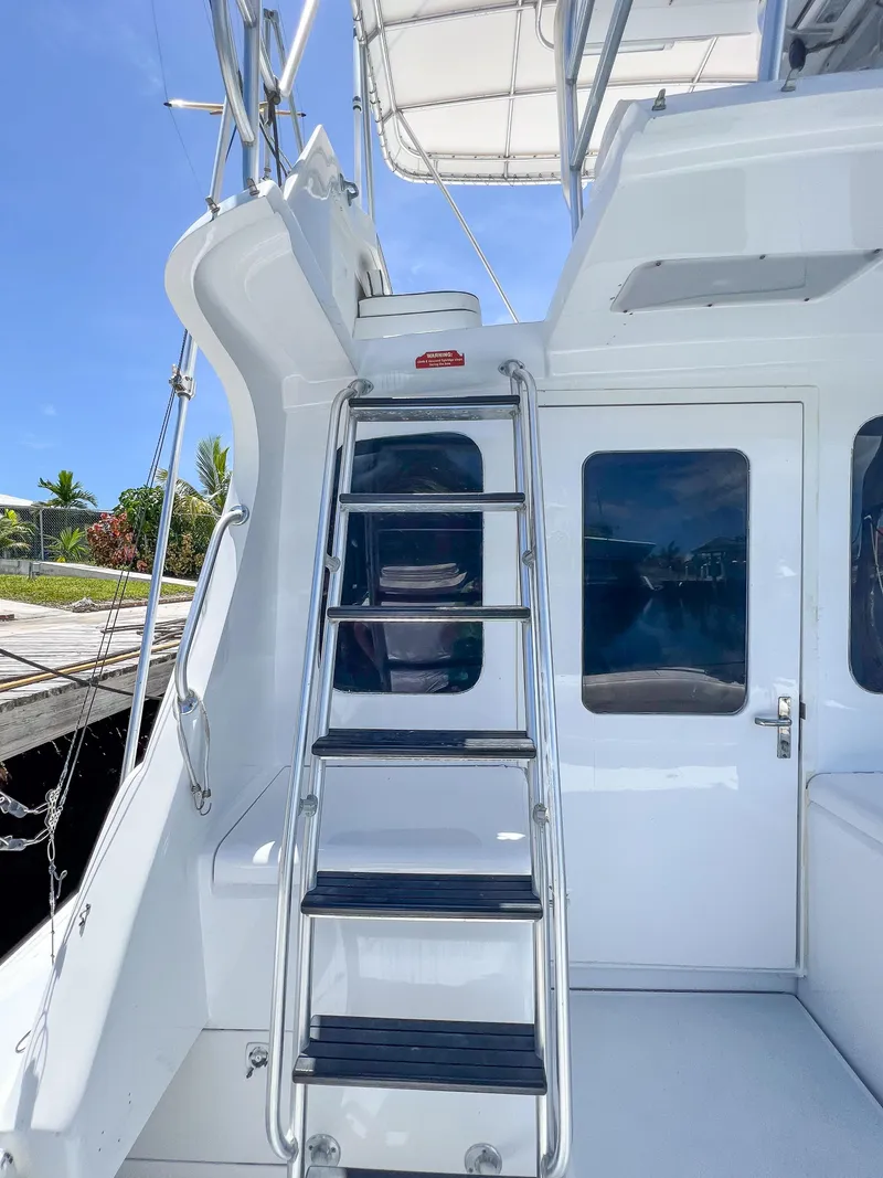 Slide: The Image of Stainless steel ladder on a 2000 Luhrs 400 Convertible yacht, leading to the flybridge. - 18
