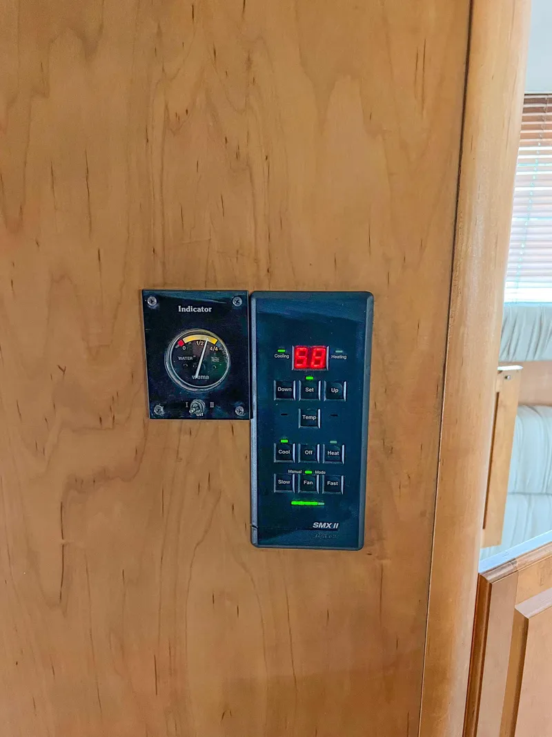 Slide: The Image of Control panel on a 2000 Luhrs 400 Convertible boat. - 23