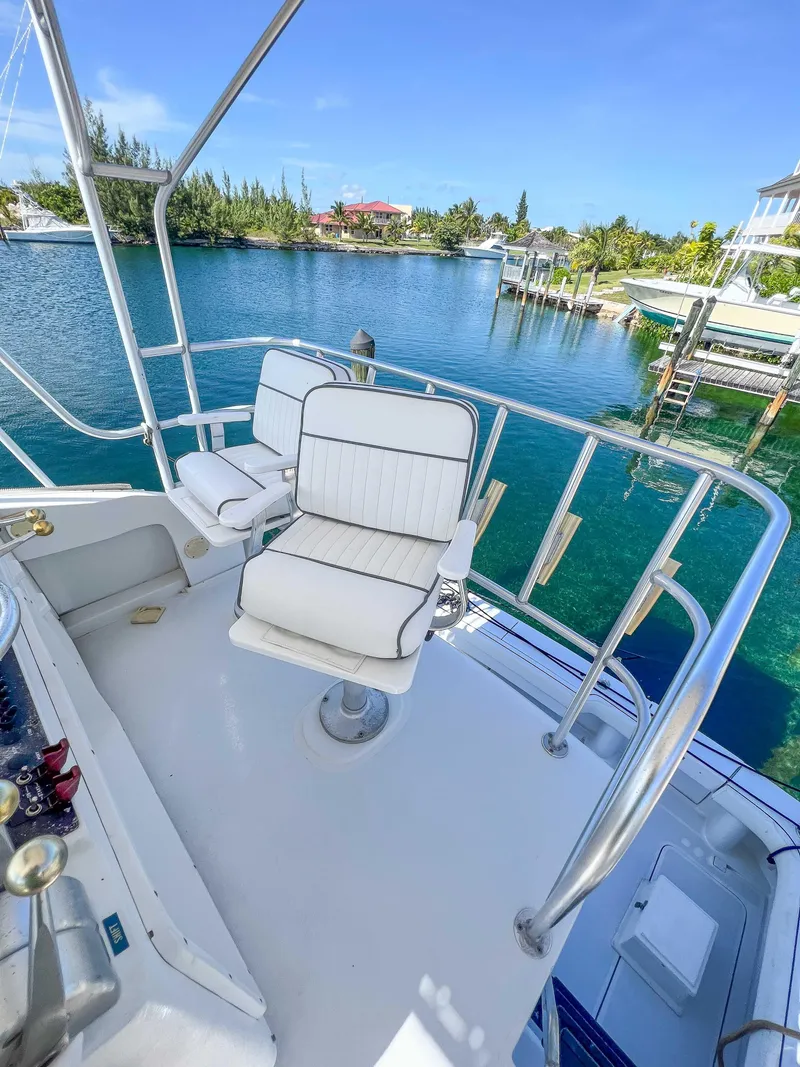 Slide: The Image of 2000 Luhrs 400 Convertible boat with white seating on a sunny day. - 9