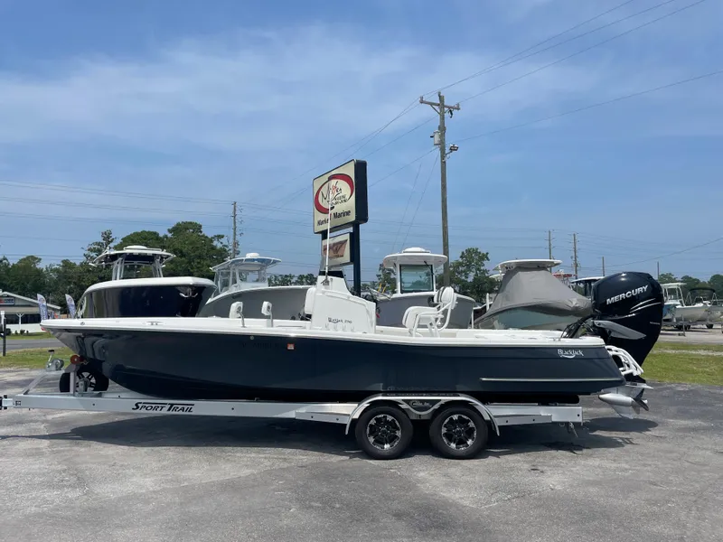 The Image of 2023 BlackJack 256 Bay boat on a trailer at a dealership. - 1