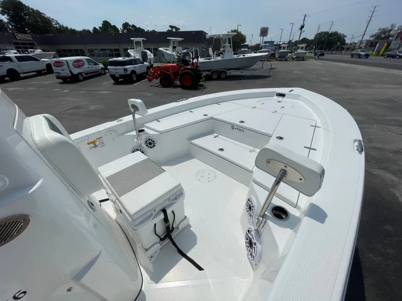 Slide: The Image of 2023 BlackJack 256 Bay boat on display in a dealership lot. - 13