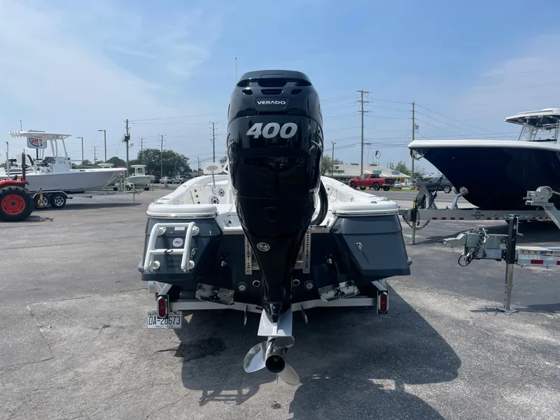 Slide: The Image of 2023 BlackJack 256 Bay boat with a 400 HP outboard motor, rear view. - 4