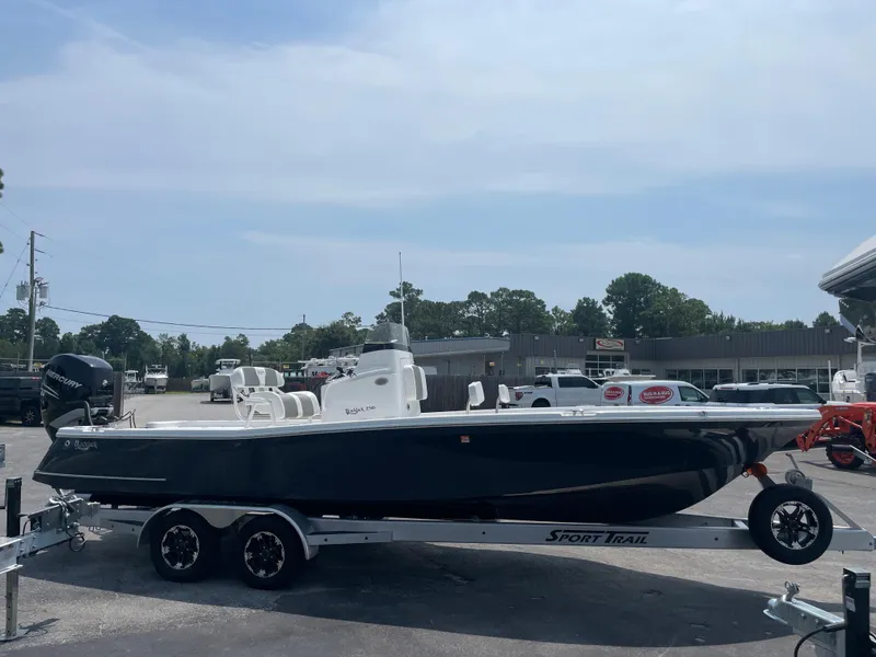 Slide: The Image of 2023 BlackJack 256 Bay boat on a Sport Trail trailer in a parking lot. - 6