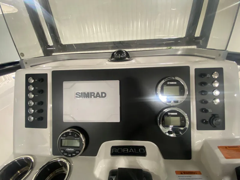 Slide: The Image of 2024 Robalo R202 Explorer dashboard with Simrad electronics and Yamaha gauges. - 12