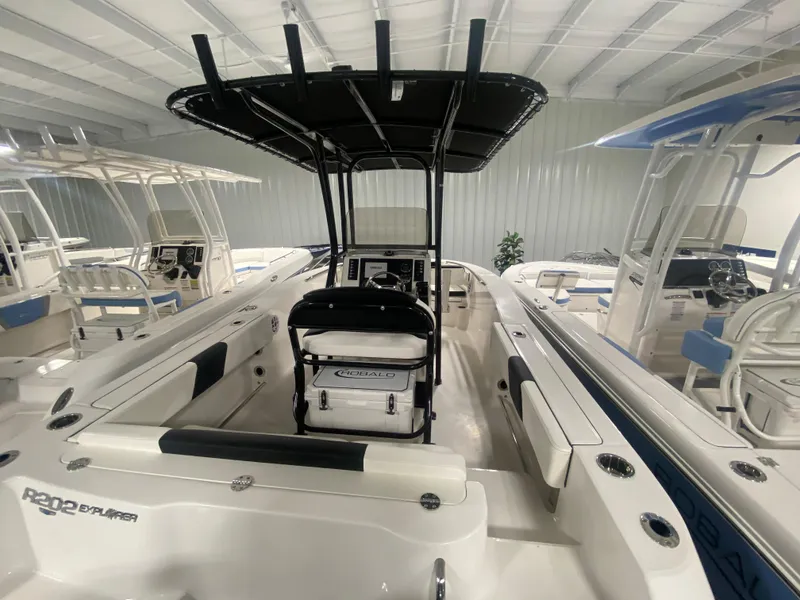 Slide: The Image of 2024 Robalo R202 Explorer boat interior with T-top and seating. - 5
