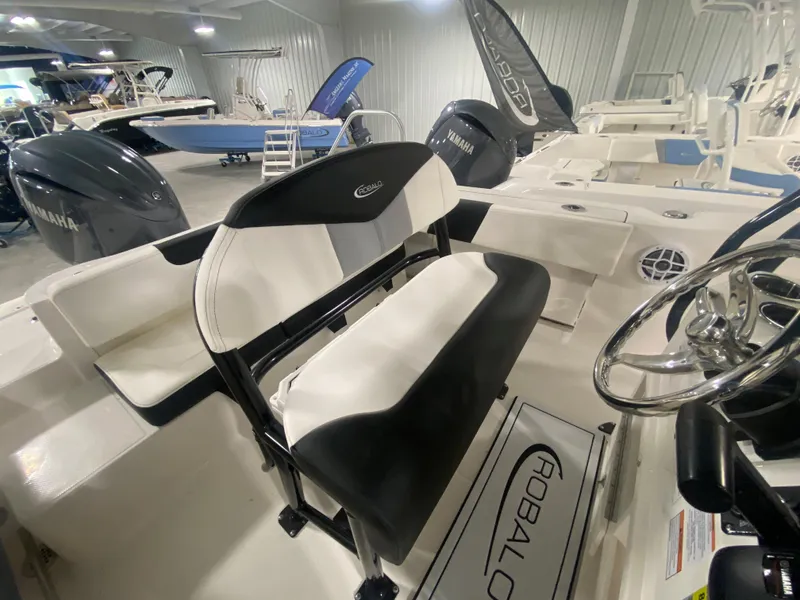Slide: The Image of 2024 Robalo R202 Explorer boat interior with seating and steering wheel. - 10