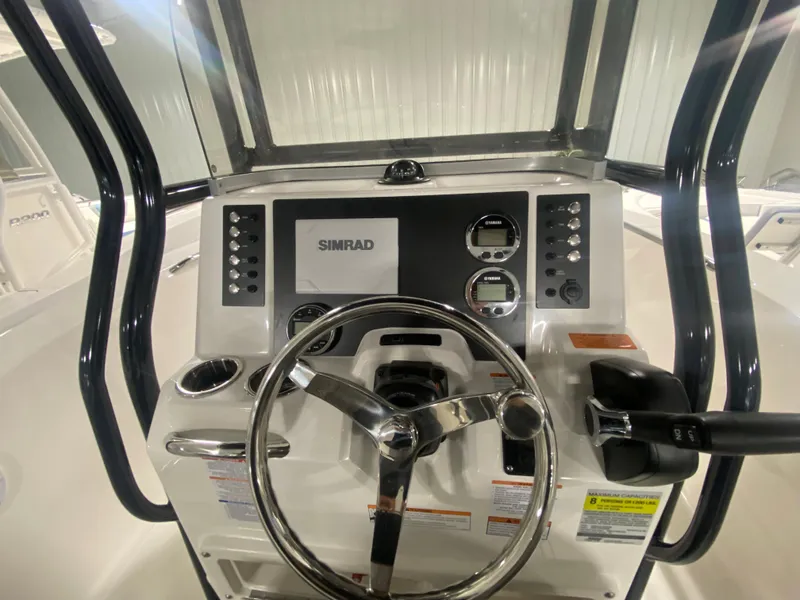 Slide: The Image of 2024 Robalo R202 Explorer boat dashboard with Simrad electronics. - 11