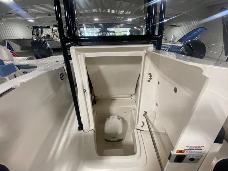 Slide: The Image of 2024 Robalo R202 Explorer boat interior with open storage compartment. - 15