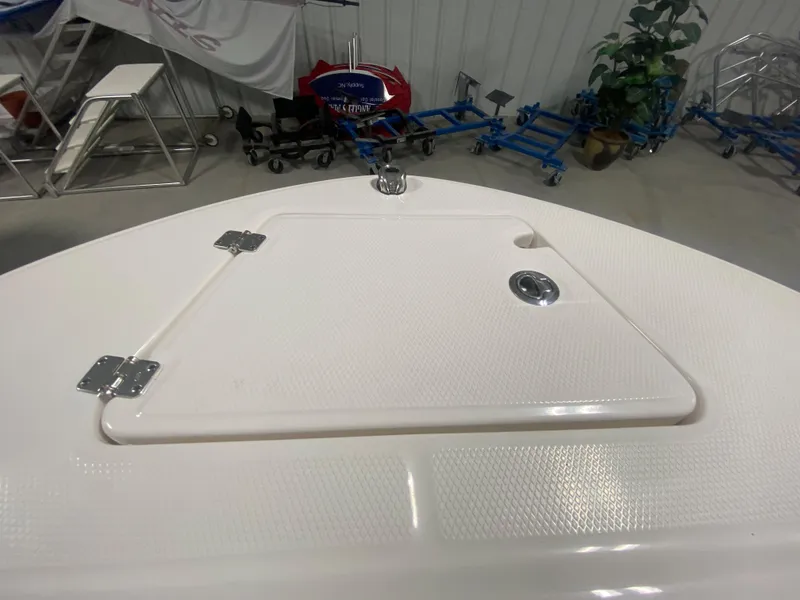 Slide: The Image of 2024 Robalo R202 Explorer boat deck with storage compartment. - 18