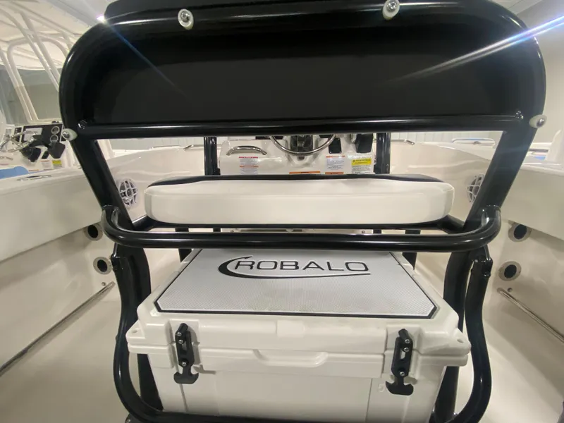 Slide: The Image of 2024 Robalo R202 Explorer boat interior with seating and storage. - 9