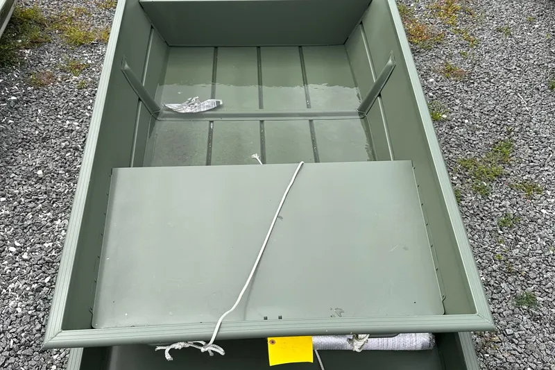 Slide: The Image of 2024 Duranautic Duke 1436 aluminum boat on gravel surface. - 0