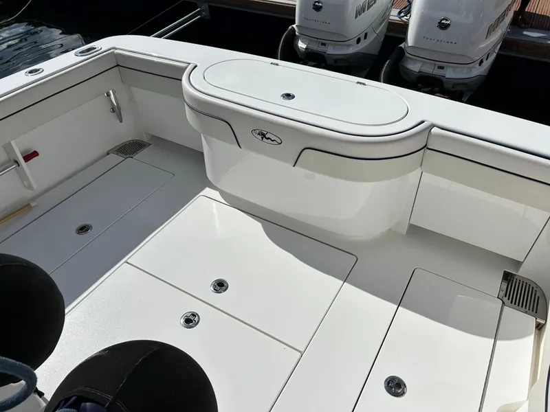Slide: The Image of 2022 Valhalla Boatworks V-33 deck with storage compartments and dual outboard engines. - 3