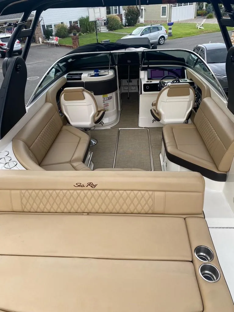 Slide: The Image of Interior view of a 2020 Sea Ray SLX 250 boat with luxurious seating. - 4