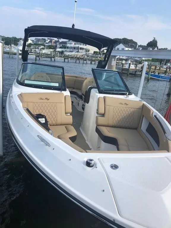 Slide: The Image of 2020 Sea Ray SLX 250 boat docked at marina. - 9
