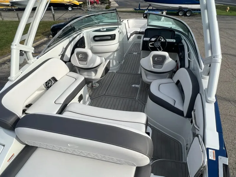 Slide: The Image of 2023 Crownline 260 SS SURF boat interior with white and gray seating. - 5