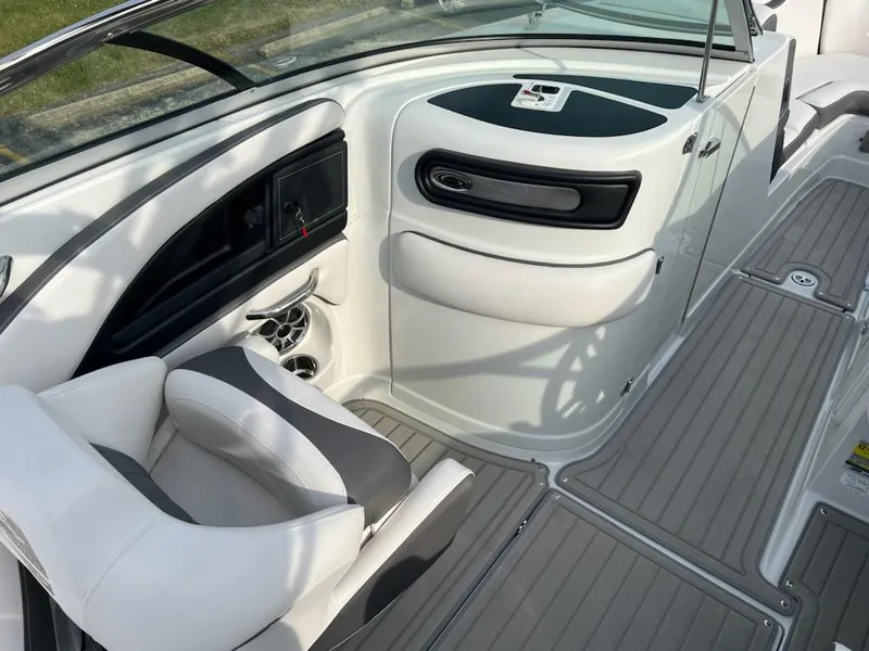 Slide: The Image of 2023 Crownline 260 SS SURF boat interior with white and gray seating. - 7