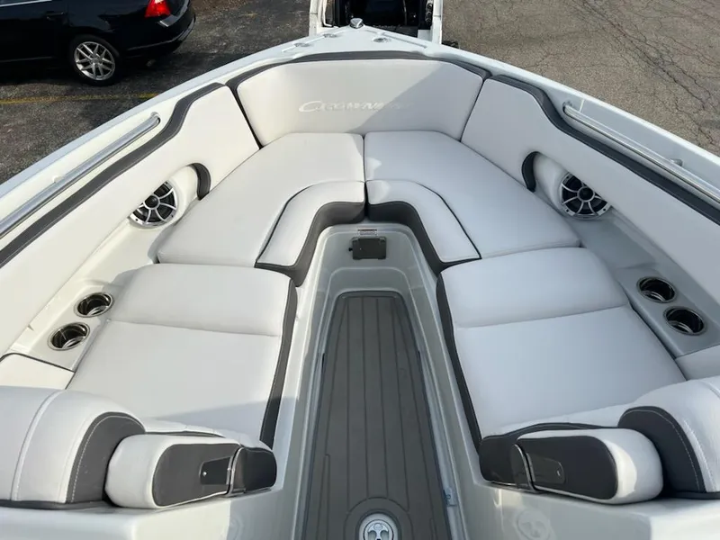 Slide: The Image of 2023 Crownline 260 SS SURF boat with spacious, cushioned seating area. - 9