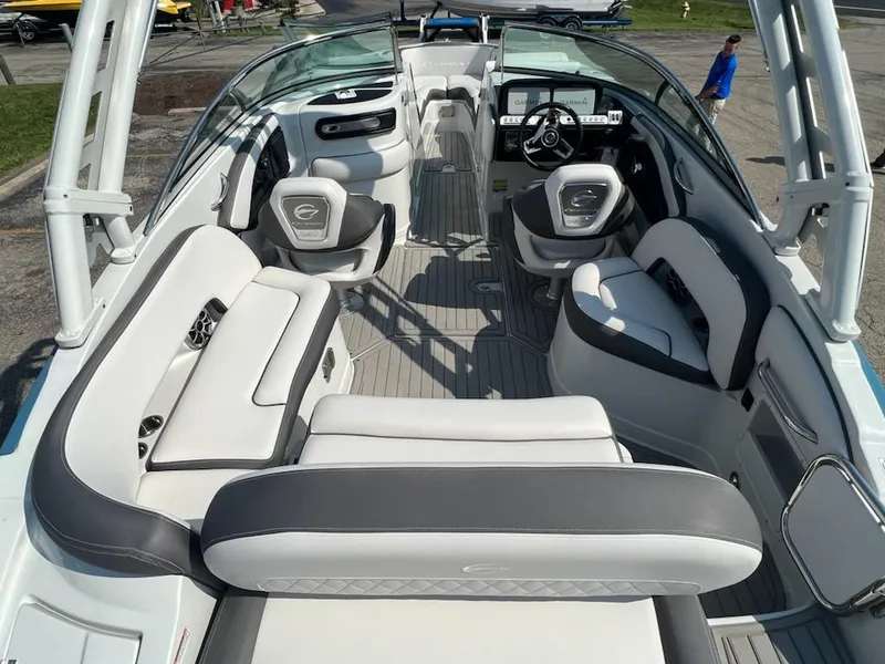 Slide: The Image of 2023 Crownline 260 SS boat interior with white and gray seating. - 2