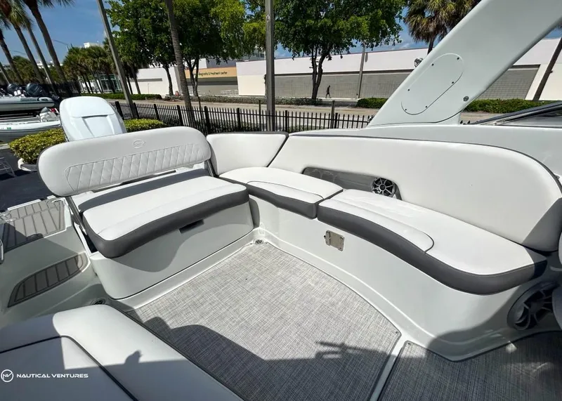 Slide: The Image of 2024 Crownline E290 XS boat interior with spacious seating and modern design. - 11