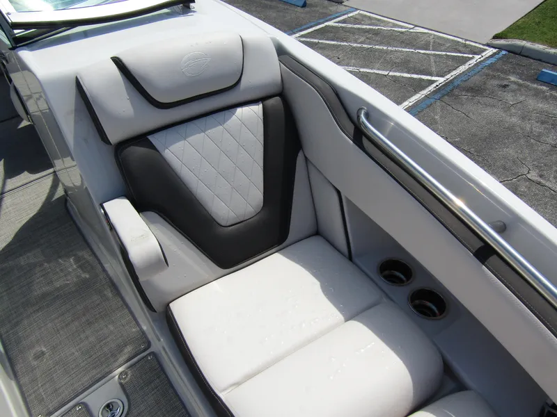 Slide: The Image of 2024 Crownline 270 XSS boat interior with luxurious seating and cup holders. - 10