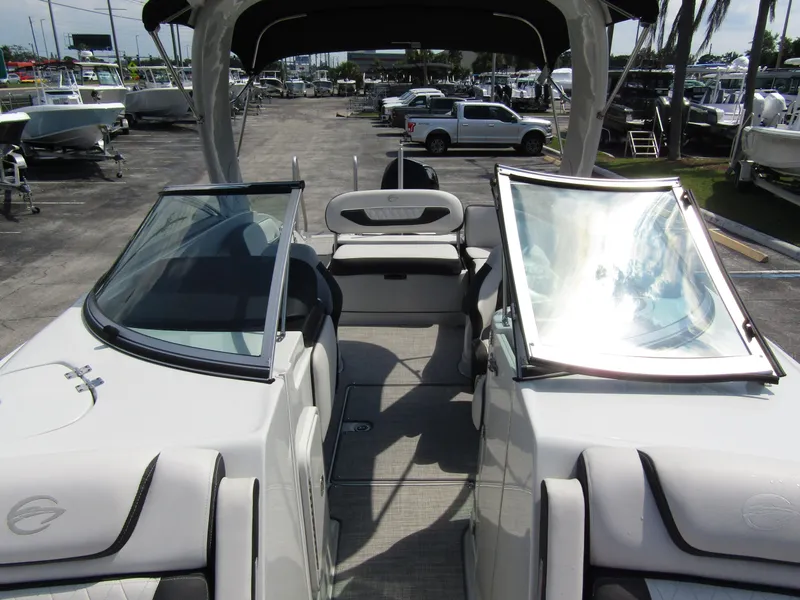 Slide: The Image of 2024 Crownline 270 XSS boat interior with seating and windshield. - 11