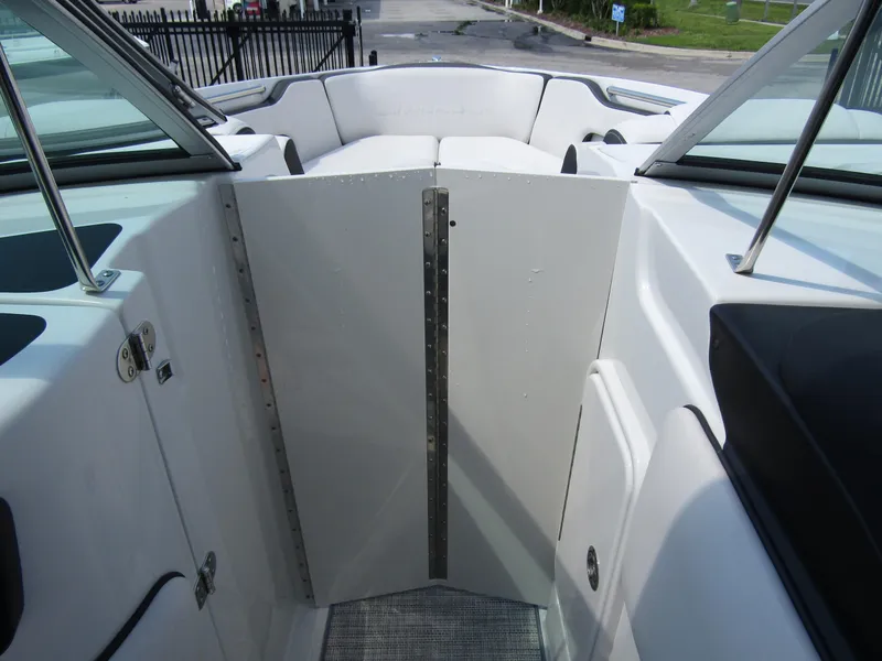 Slide: The Image of 2024 Crownline 270 XSS boat interior with open bow seating and sleek design. - 13