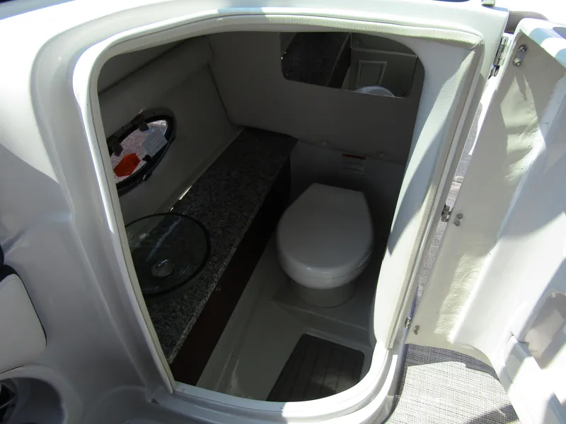 Slide: The Image of 2024 Crownline 270 XSS boat interior bathroom with modern amenities. - 24