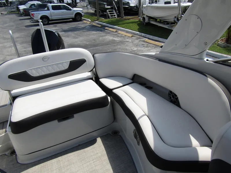 Slide: The Image of 2024 Crownline 270 XSS boat interior with white and black seating. - 28