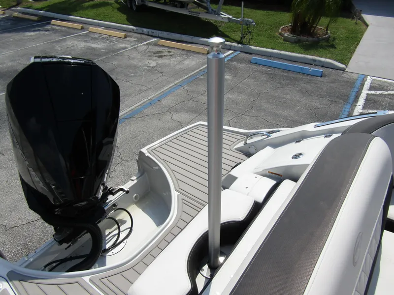 Slide: The Image of 2024 Crownline 270 XSS boat with outboard motor and swim platform. - 31