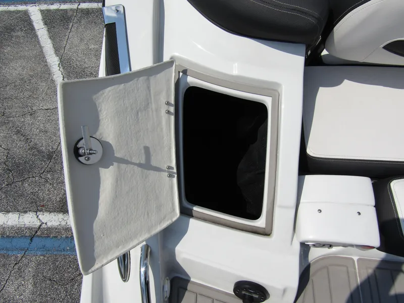 Slide: The Image of 2024 Crownline 270 XSS boat storage compartment with open hatch. - 36