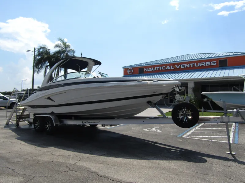 Slide: The Image of 2024 Crownline 270 XSS boat on trailer at Nautical Ventures dealership. - 5