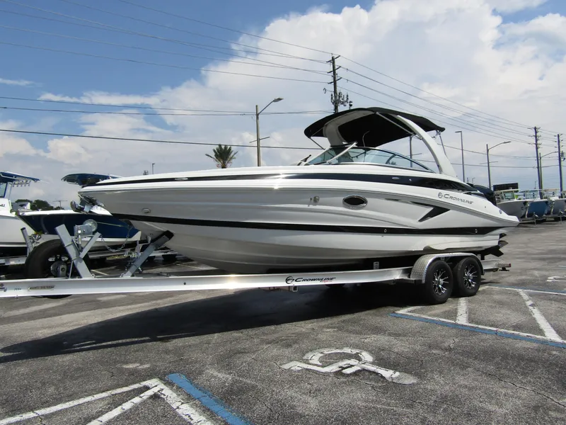 Slide: The Image of 2024 Crownline 270 XSS boat on trailer in parking lot. - 6