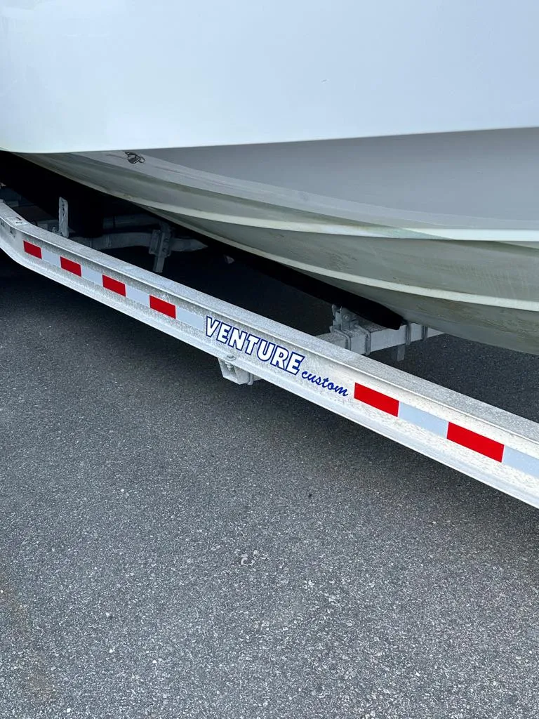 Slide: The Image of 2021 Everglades 253 boat on Venture Custom trailer. - 15
