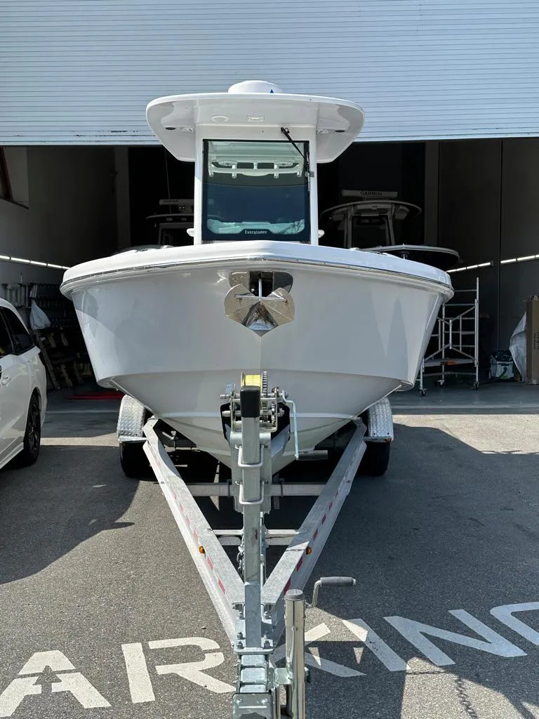 Slide: The Image of 2021 Everglades 253 boat on trailer in parking area. - 3