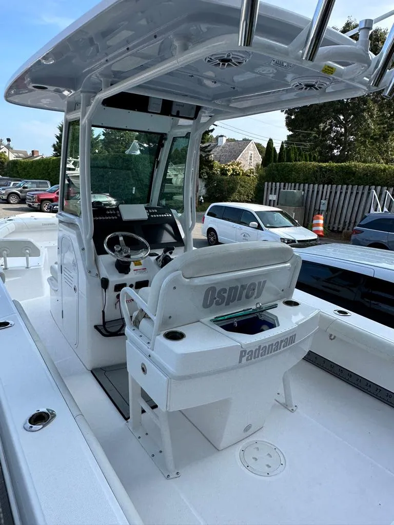 Slide: The Image of 2021 Everglades 253 boat interior with helm station and seating. - 5