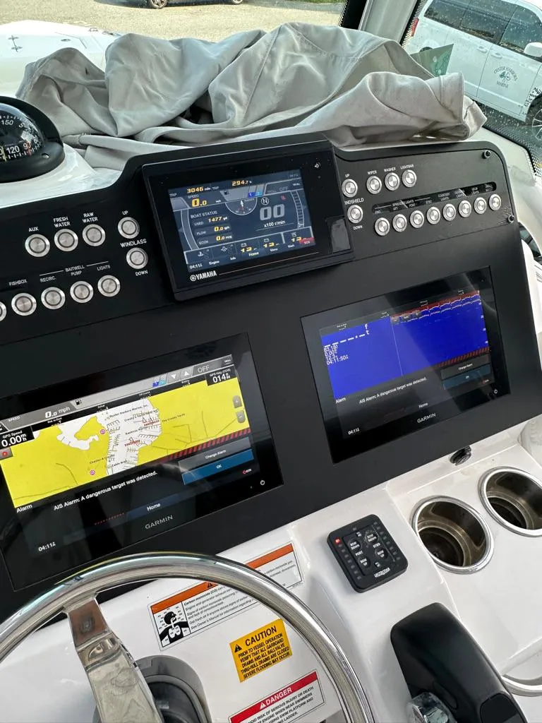 Slide: The Image of Control panel of a 2021 Everglades 253 boat with navigation and sonar screens. - 6