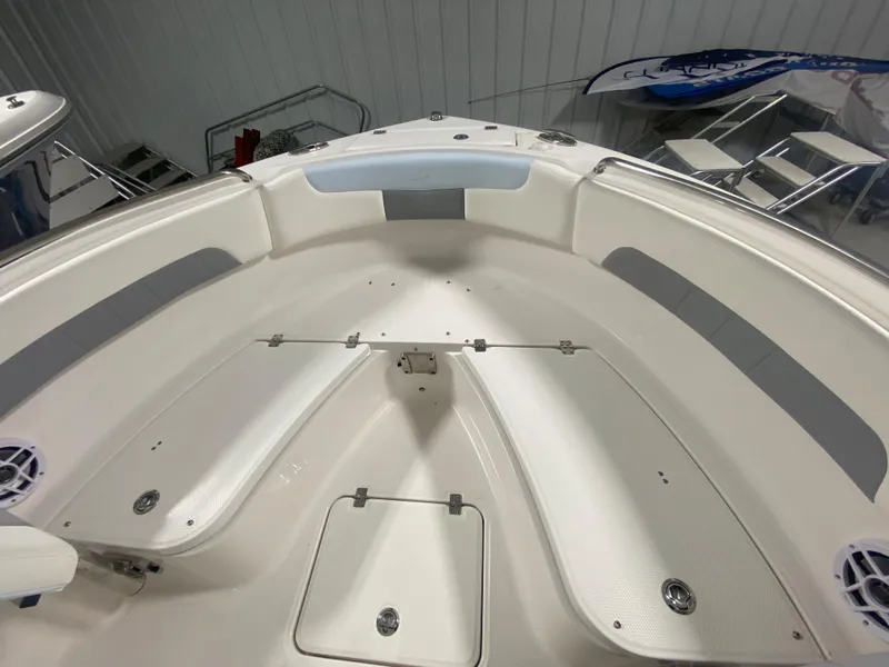 Slide: The Image of 2024 Robalo R222 Center Console boat interior, featuring spacious seating and storage compartments. - 18