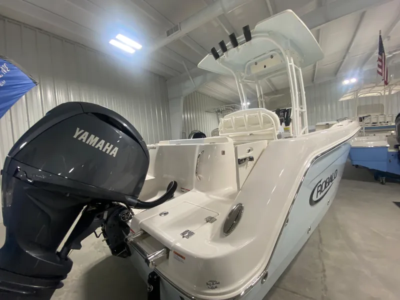 Slide: The Image of 2024 Robalo R222 Center Console boat with Yamaha outboard motor in showroom. - 3
