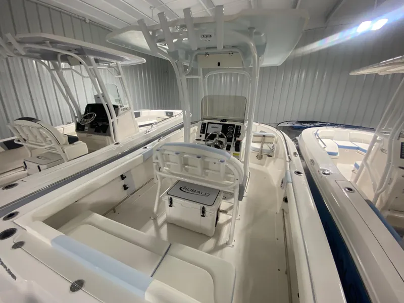Slide: The Image of 2024 Robalo R222 Center Console boat interior in showroom. - 4