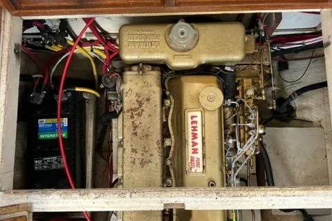Slide: The Image of 1978 Grand Banks Trawler engine compartment with Lehman engine and battery. - 33