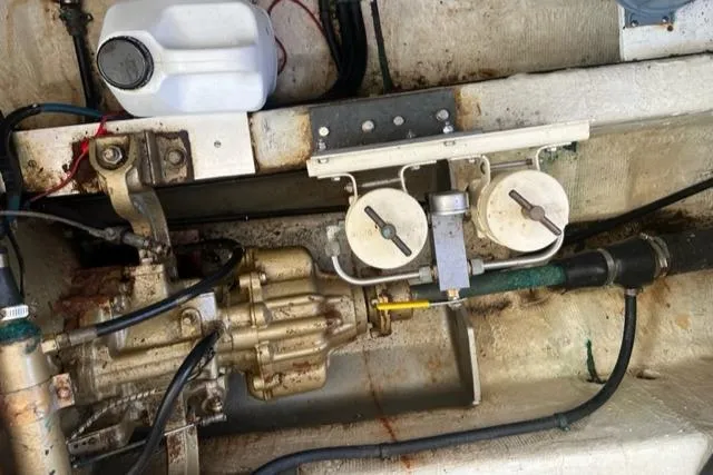 Slide: The Image of Engine room of a 1978 Grand Banks Trawler, featuring mechanical components and gauges. - 38